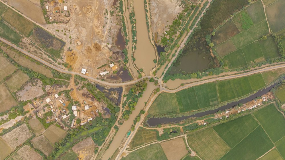 Drone view of agricultural fields, waterways, and rural roads.