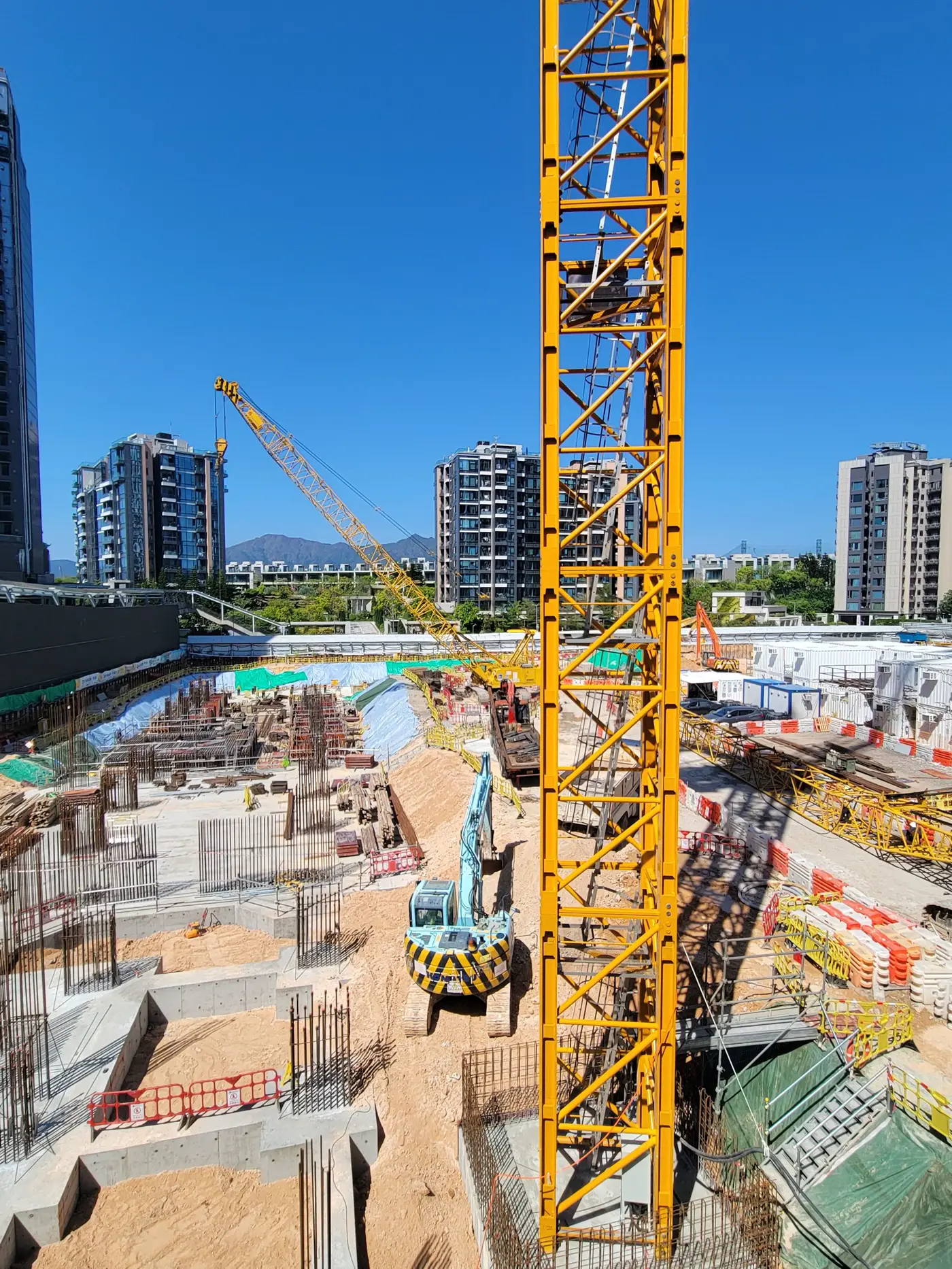 Building site and tower cranes from the Embuilded website.